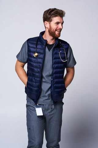 [Navy] Nurse wearing the Dr. Woof Apparel Men's Puffer Vest 